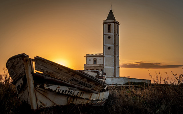 Boat grass tower sunset puzzle free wallpaper - medium preview image