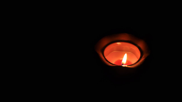 Lit candle dark black background #2 free wallpaper - medium preview image