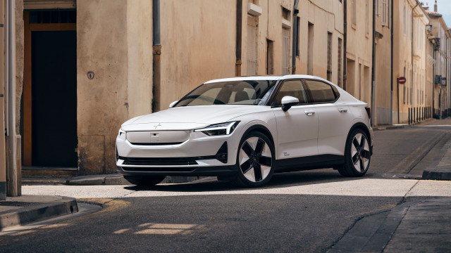 White car street building sidewalk free wallpaper - medium preview image