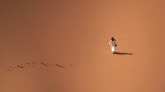 Desert footprints birdseye orange sunset free wallpaper - medium preview image