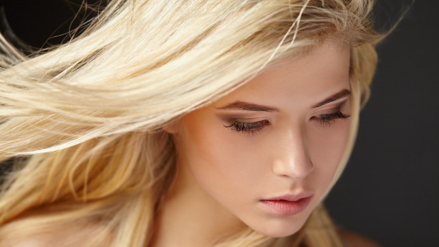 Blonde woman blowing wind closed free wallpaper - medium preview image