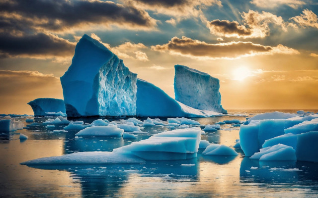 Icebergs ocean sunset cloudy sky free wallpaper - medium preview image