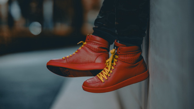 Person red yellow sneakers wall free wallpaper - medium preview image