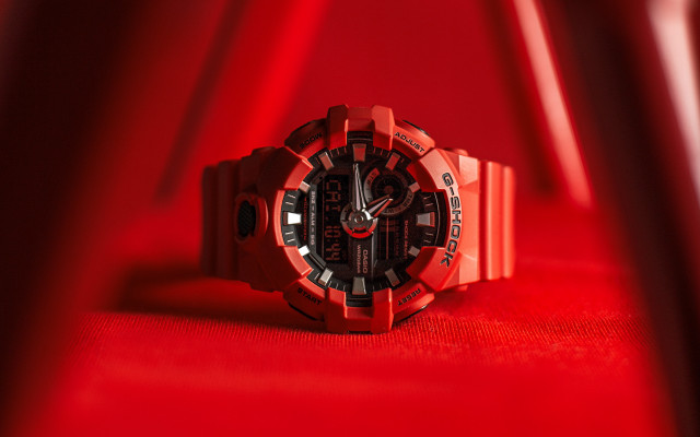 Red watch on red surface free wallpaper - medium preview image