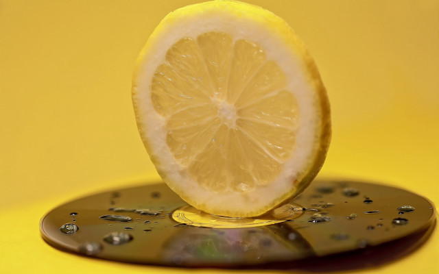 Lemon yellow surface water droplets free wallpaper - medium preview image