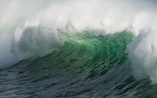 Large wave crashing over surfer free wallpaper - medium preview image