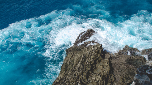 Rocky cliff water foreground beach free wallpaper - medium preview image