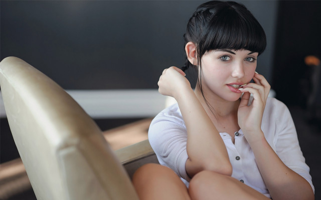 Serious asian woman chair black free wallpaper - medium preview image