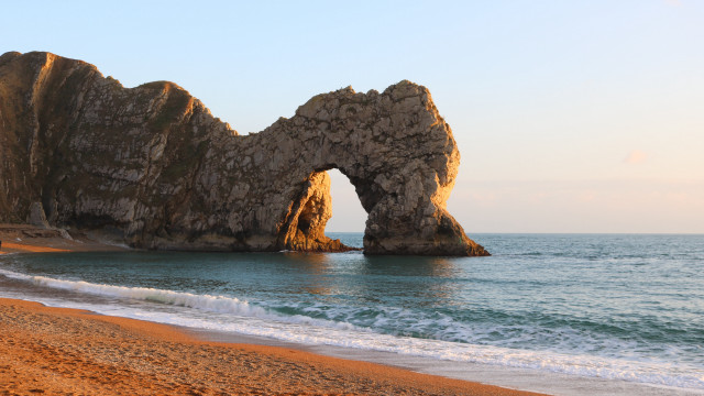Beach rock formation waves sunset free wallpaper - medium preview image