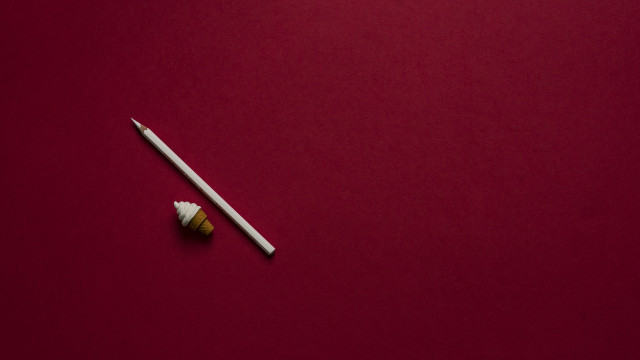 White toothbrush tube red surface free wallpaper - medium preview image