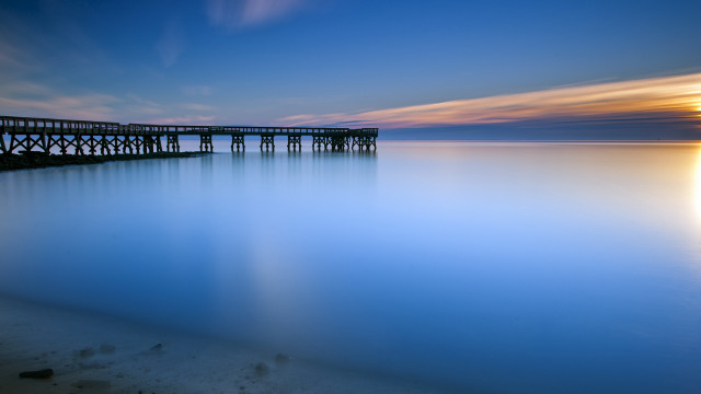 Pier sunset calm water reflection free wallpaper - medium preview image