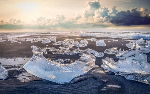 Ice chunks beach cloudy sky free wallpaper - medium preview image