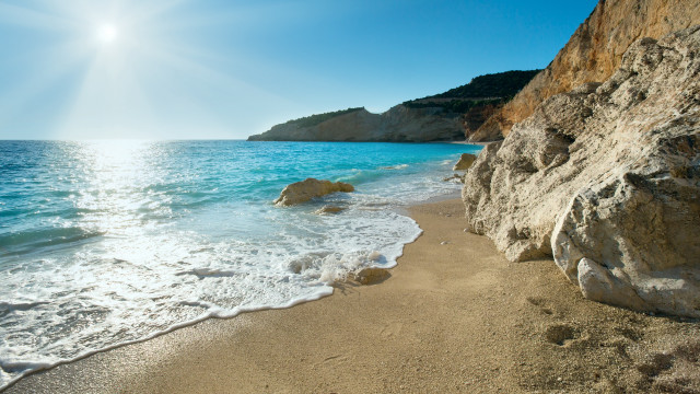 Beach cliff water sunburst matte free wallpaper - medium preview image