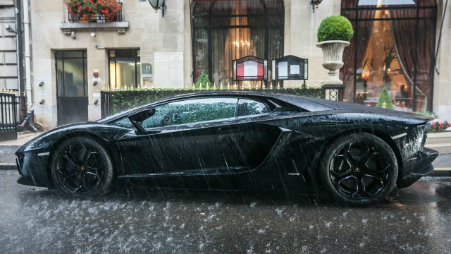 Black sports car rainy street free wallpaper - medium preview image
