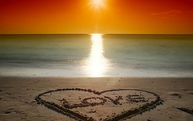 Heart sand beach sunset ocean free wallpaper - medium preview image