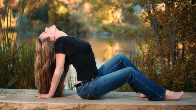 Woman sitting rock closed eyes free wallpaper - medium preview image
