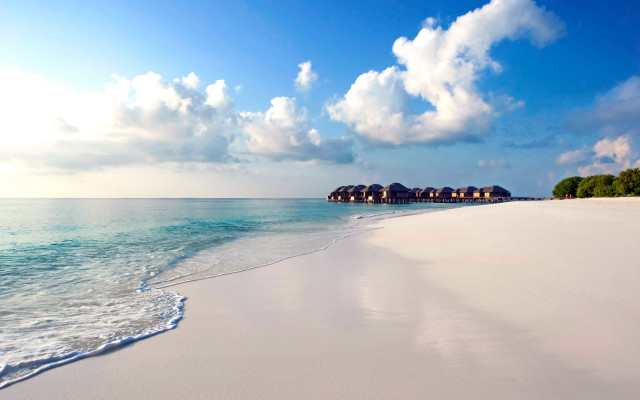 Beach huts waves sky mountains free wallpaper - medium preview image