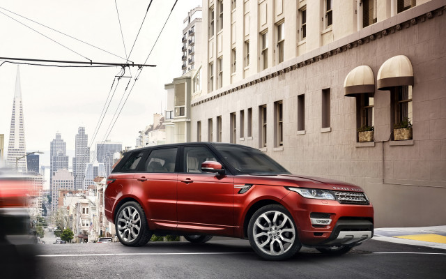 Red range rover city street free wallpaper - medium preview image