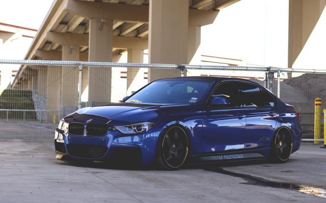 Blue car building fence parking free wallpaper - medium preview image
