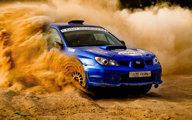 Blue car dusty desert action free wallpaper - medium preview image