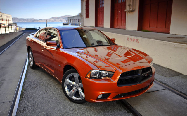 Red car road building water free wallpaper - medium preview image