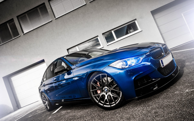 Blue car building garage open free wallpaper - medium preview image