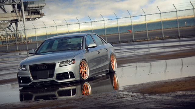 Silver car wet road fence free wallpaper - medium preview image