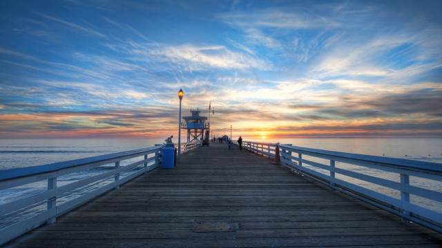 Pier lighthouse sunset ocean clouds free wallpaper - medium preview image