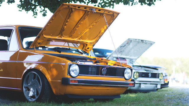 Yellow car hood open grass free wallpaper - medium preview image