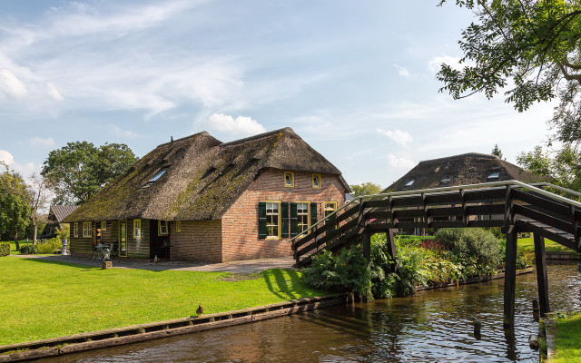 Thatched roof house river bridge free wallpaper - medium preview image