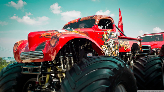Red truck monster wheels field free wallpaper - medium preview image