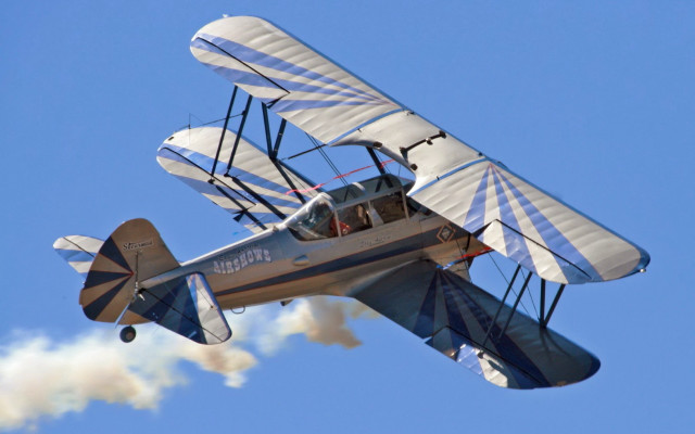 Small airplane blue sky smoke #2 free wallpaper - medium preview image