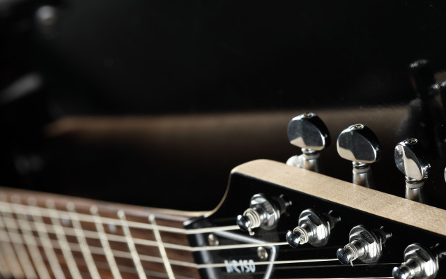 Guitar neck closeup black background #4 free wallpaper - medium preview image