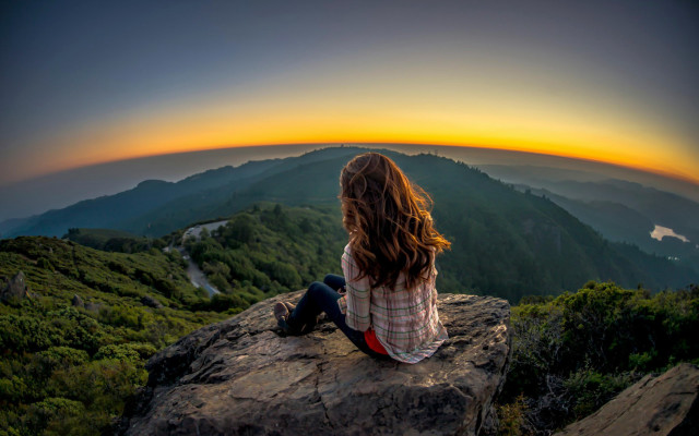 Woman sitting rock sunset valley free wallpaper - medium preview image