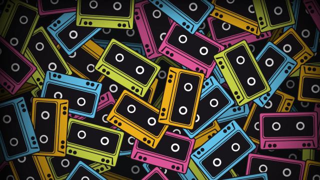 Colorful cassettes scattered black background free wallpaper - medium preview image