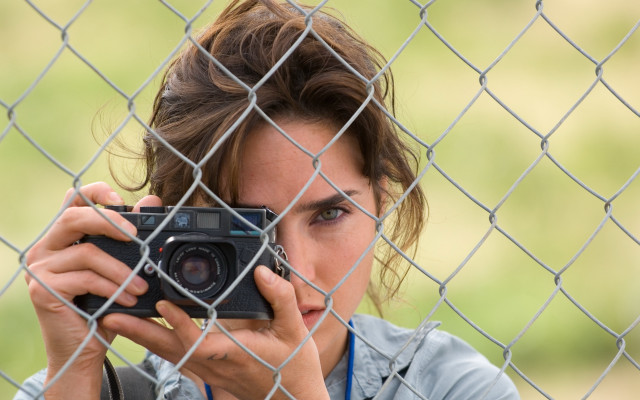 Woman camera fence look through free wallpaper - medium preview image