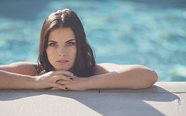 Woman leaning pool beach sky free wallpaper - medium preview image