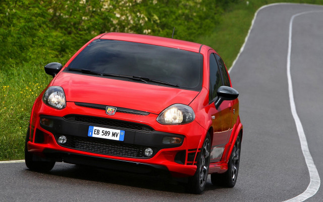 Red car winding road forest free wallpaper - medium preview image