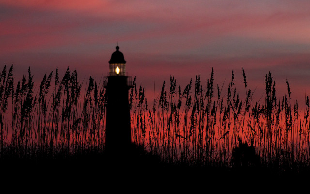 Lighthouse silhouette redsky tallgrass sunset free wallpaper - medium preview image