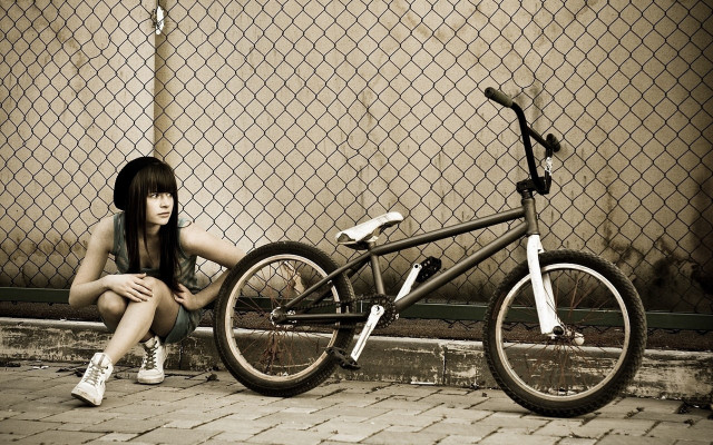 Woman bike fence graffiti art free wallpaper - medium preview image