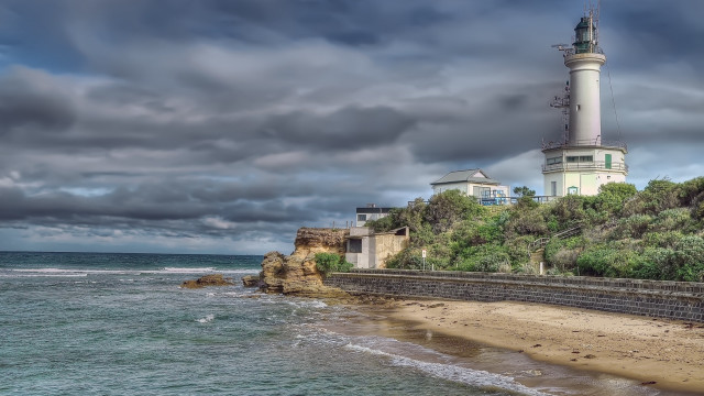 Lighthouse cliff ocean stormy weather free wallpaper - medium preview image