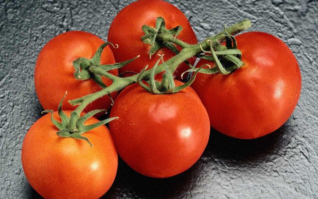 Tomatoes green stem gray surface free wallpaper - medium preview image