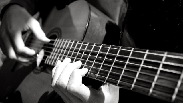 Person playing guitar hands strings #3 free wallpaper - medium preview image