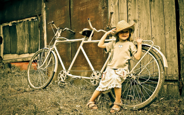 Young girl bicycle barn hat free wallpaper - medium preview image