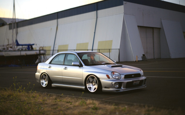 Silver car building grass tilt free wallpaper - medium preview image