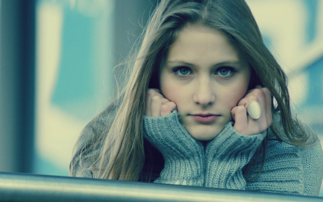 Woman longhair sweater leaning on free wallpaper - medium preview image