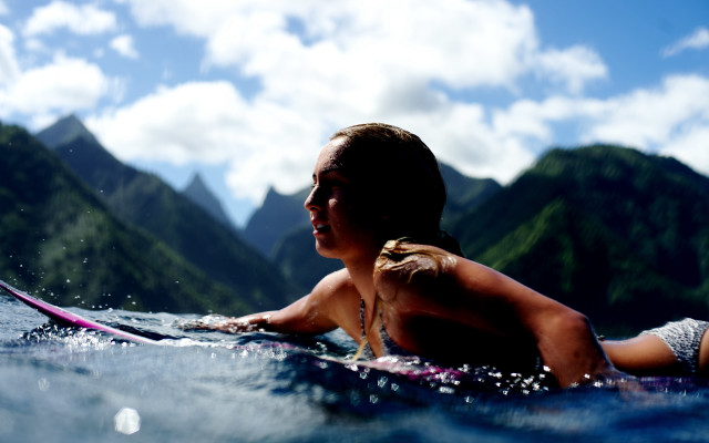 Woman surfboard mountains clouds beach free wallpaper - medium preview image