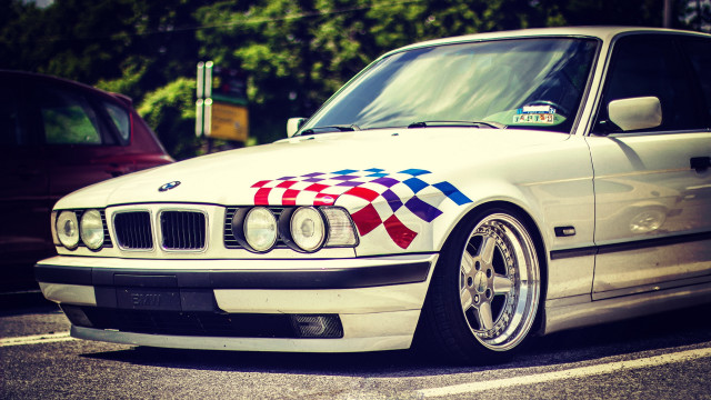 White car checkered hood parking free wallpaper - medium preview image