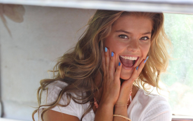 Cheerful woman blue nails smiling free wallpaper - medium preview image