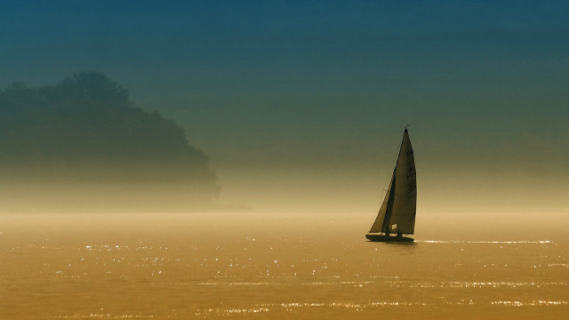 Sailboat foggy lake tranquil beach free wallpaper - medium preview image
